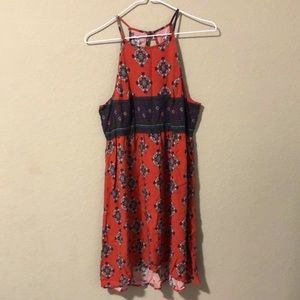 Burnt orange patterned dress.